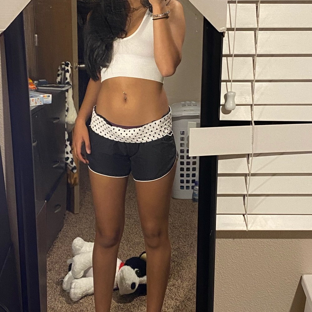 Black and white athletic shorts, with pockets